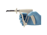 Hand holding dental tool with blue glove on a white background