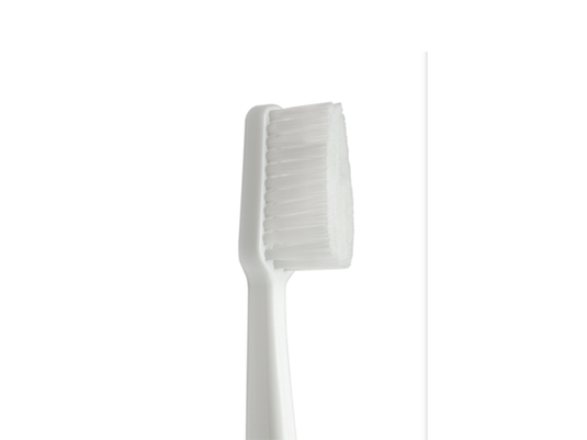 White Gentle Care Toothbrush up close.