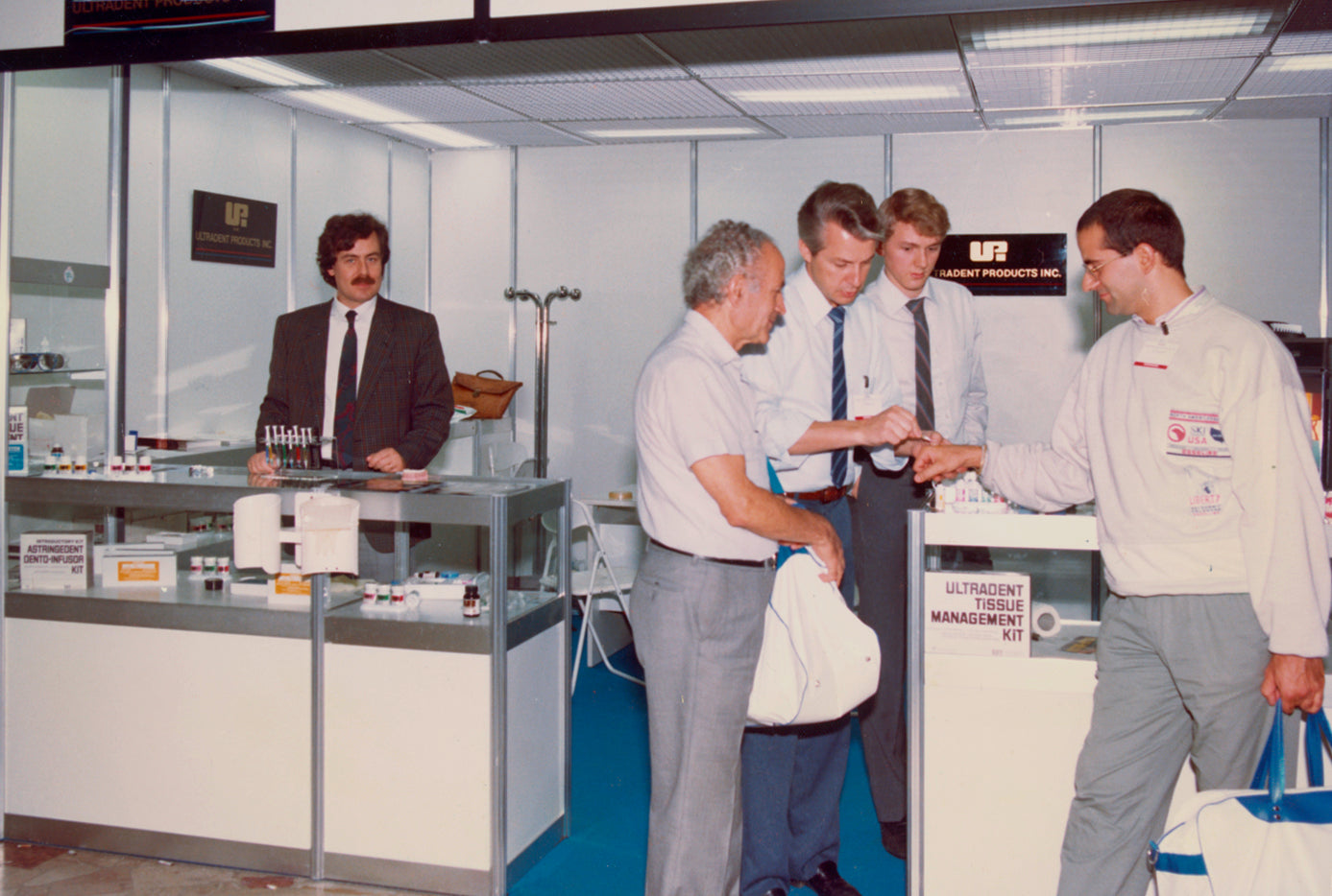 Dr. Fischer at an Ultradent booth in the 80s