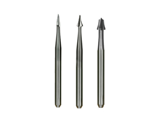 A close-up of three Calla Lily fissurotomy carbide dental burs lined up side by side on a white background.